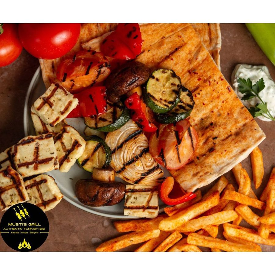 Grilled halloumi and mixed vegetable skewers with flatbread and chips at Musti's Grill & Bistro