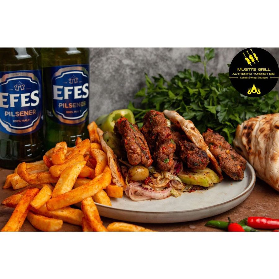 Lamb köfte skewers with flatbread, chips and salad at Musti's Grill & Bistro