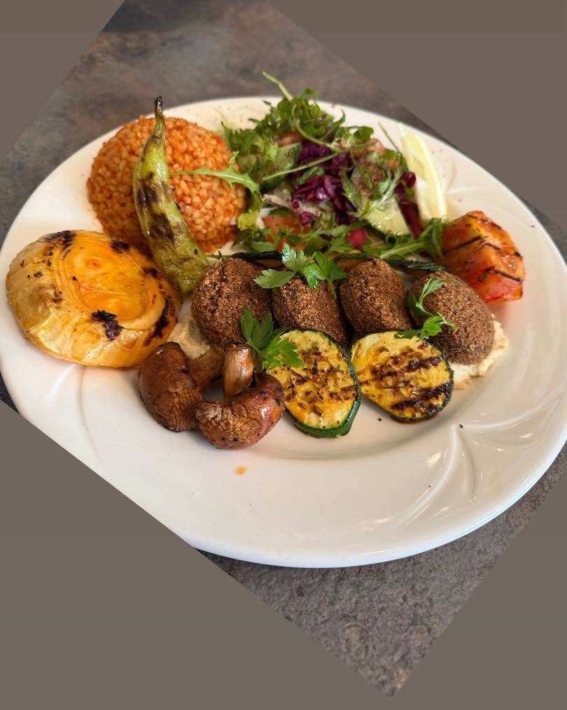 Mixed grill platter with falafel, salad and rice