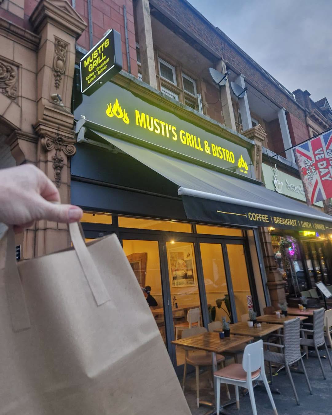 Musti's Grill & Bistro shopfront and outdoor seating